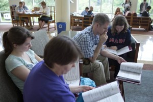 A family studies materials distributed during an on-campus admission program. (Phyllis Graber Jensen/Bates College)